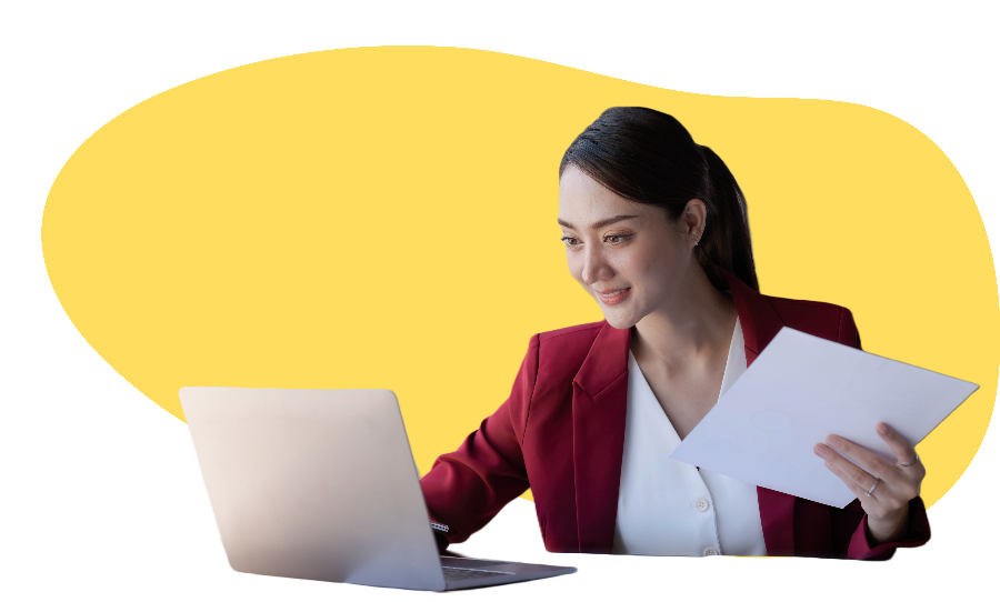 woman lawyer looking at computer smiling and holding documents-1